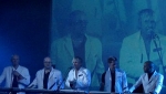 The men in white coats arrive