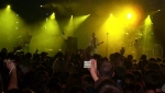 The crowd watch a yellow stage