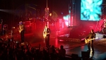 The stage with Delirious?, video screen and a screaming crowd