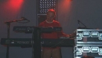 Tim singing from behind his keyboards