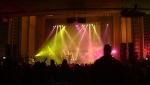 The crowd watch a spectacularly lit stage