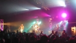 The band bathed in purple light