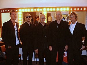 Delirious? in their dressing room in pinstriped suits